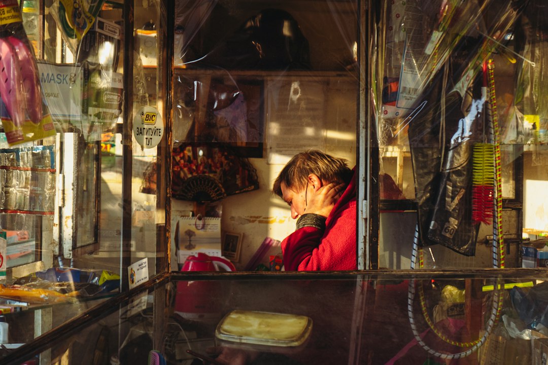 Local shop owner at the counter of her store