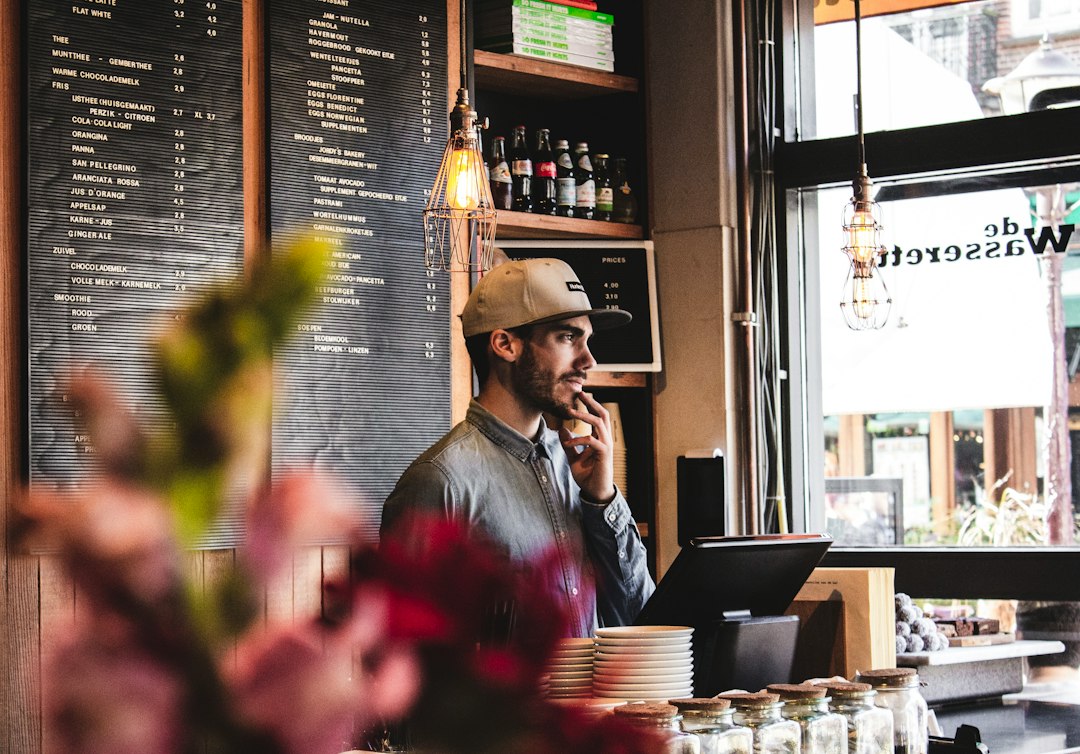 Local business owner standing in his shop